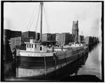 Loading lumber on steamer at lumberyards, Menominee, Mich.