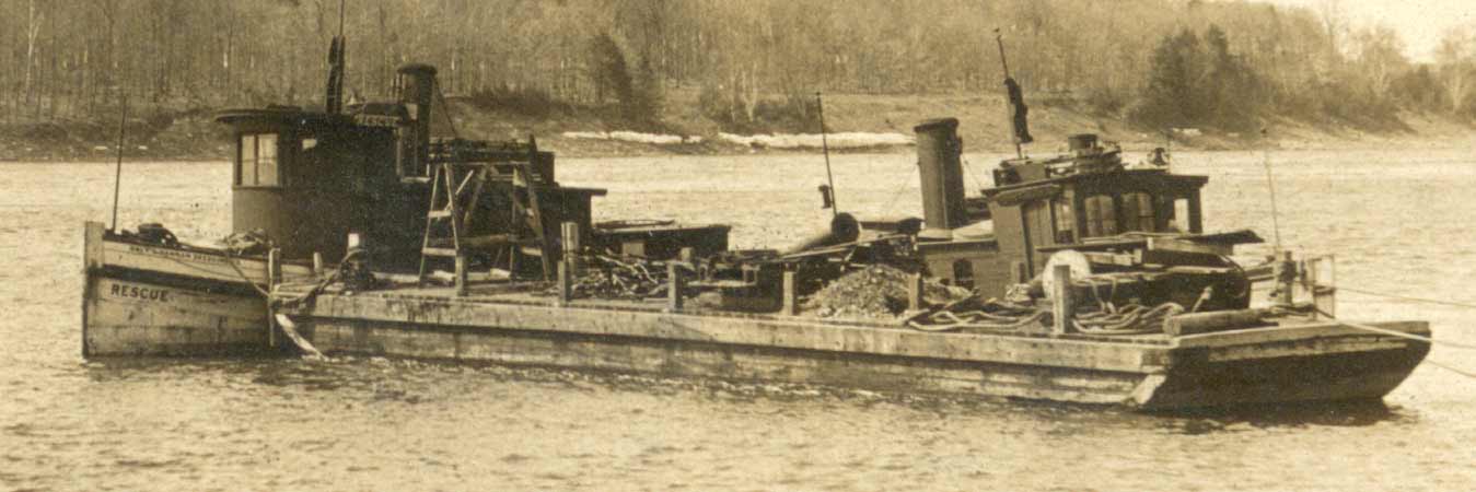 Two tugboats and a barge