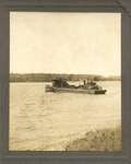 Two tugboats and a barge