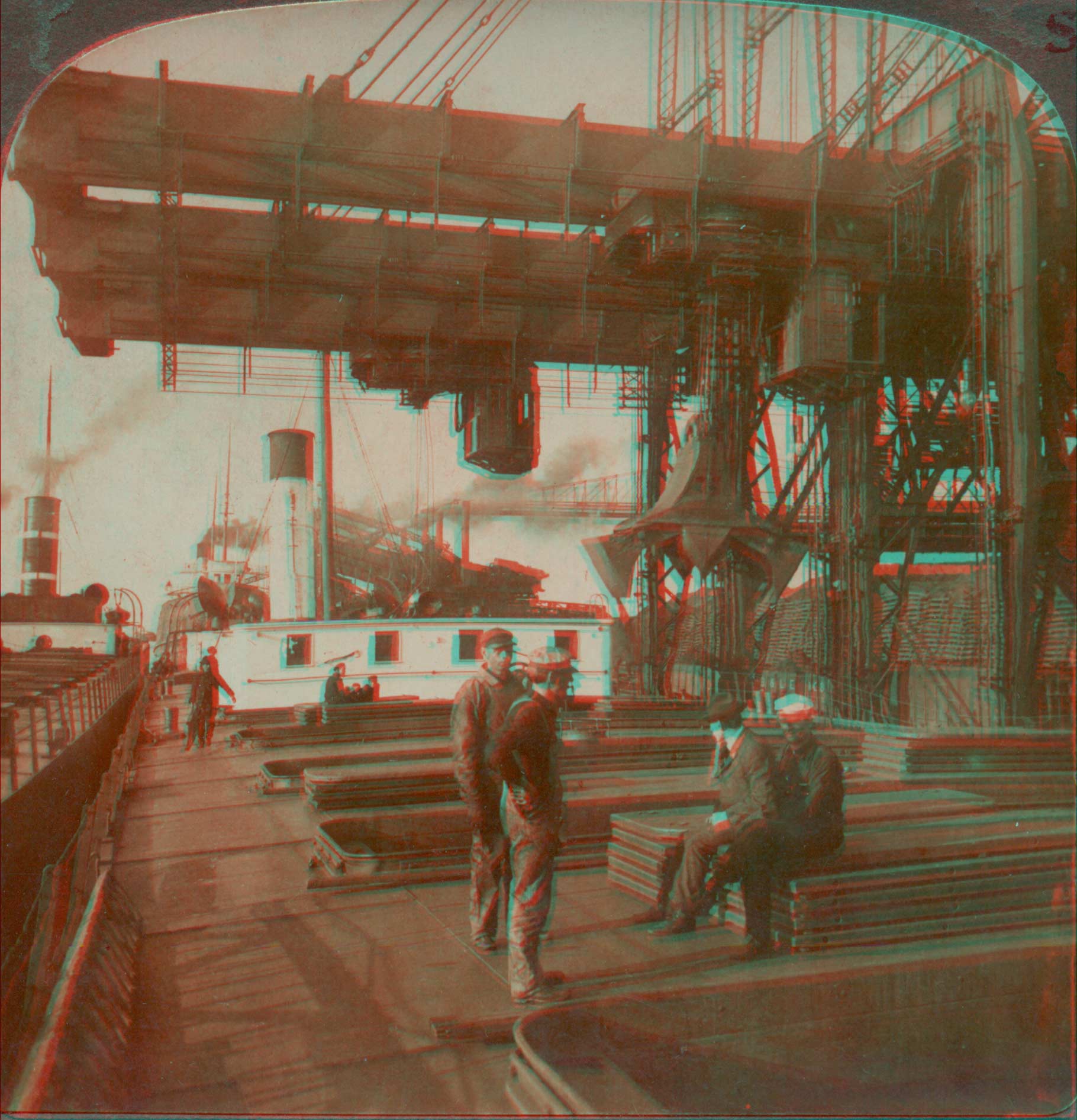 Unloading an ore-steamer at Cleveland, O. -- lowering a 5-ton electric clam into the hold