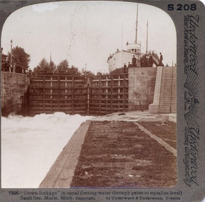 &quot;Down-lockage&quot; in canal (letting water through gates to equalize level) Sault Ste. Marie, Mich.